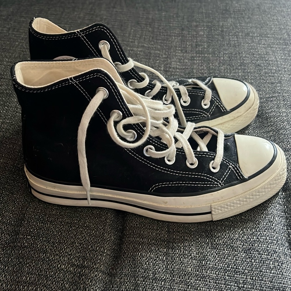 Black Converse Hi-Tops.